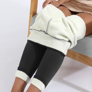 Legging thermique doublé en polaire noir, empiècements en polaire claire aux chevilles et au bas