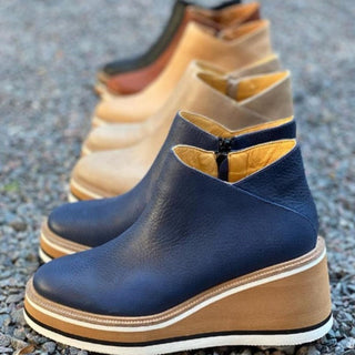 Bottines femme bleu foncé à semelle plateforme, fermeture latérale, tiges hautes.