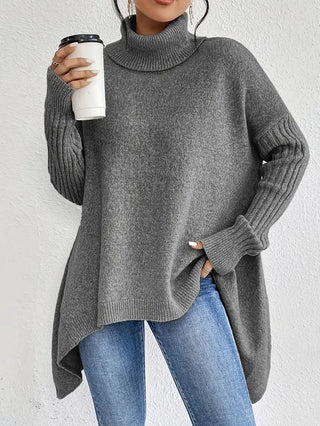 Pull en cachemire gris, col roulé côtelé, manches longues, coupe ample asymétrique