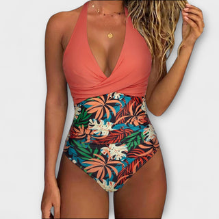 Maillot de bain une pièce femme corail, décolleté en V, imprimé feuilles tropicales, taille froncée.