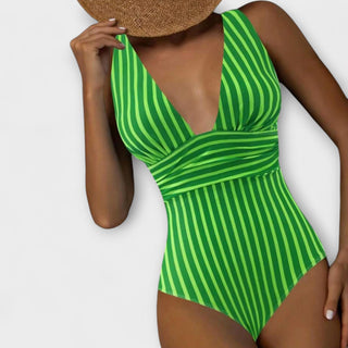 Maillot de bain une pièce rayé vert, décolleté V plongeant et manches échancrées.