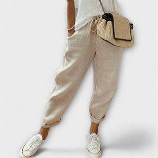 Pantalon décontracté beige à chevilles élastiques, coupe ample.