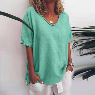 T-shirt ample en lin vert, encolure dégagée, manches courtes et fentes latérales