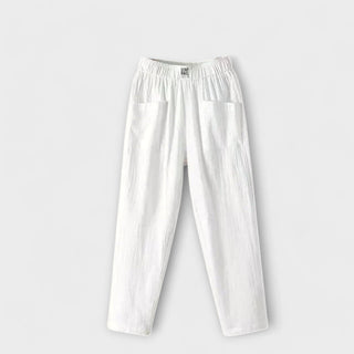 Pantalon en coton et lin blanc, taille élastique, poches plaquées.