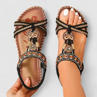 Sandales orthopédiques Maryna™ noires à lanières croisées, pendentifs décoratifs et semelle