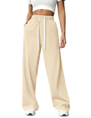 Pantalon de jogging femme taille haute beige à cordon, jambe droite ample.