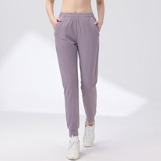 Pantalon de sport mauve, poches latérales et taille élastique