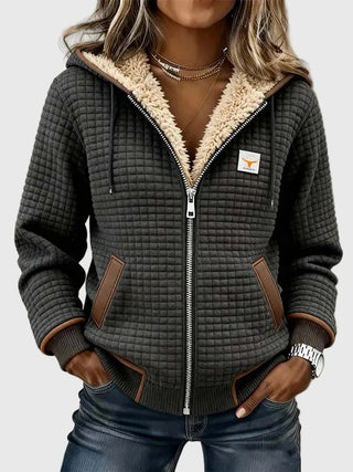 Veste à capuche gris foncé matelassée, poignets côtelés et poches à liseré brun