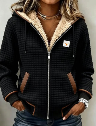 Veste noire à capuche matelassée, doublure en peluche et fermeture zippée