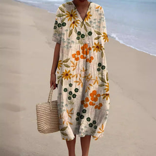 Robe ample à col V, manches courtes, motif floral jaune et orange sur fond crème