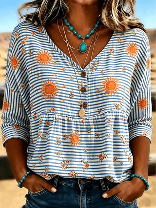 Blouse à col V et boutons, rayures bleues et blanches avec soleils orange