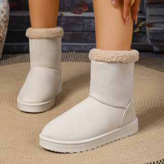 Bottes fourrées mi-mollet blanches, revers en moumoute, tige en suédine, semelle antidérapante