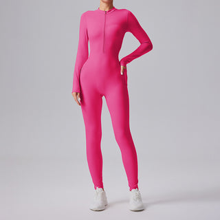 Combinaison de sport fuchsia moulante à manches longues et demi-zip