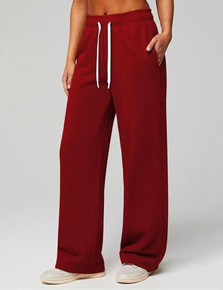 Pantalon de jogging femme taille haute rouge bordeaux à cordon, jambe droite ample.
