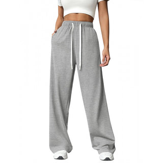 Pantalon de jogging femme taille haute gris clair à cordon, jambe droite ample.