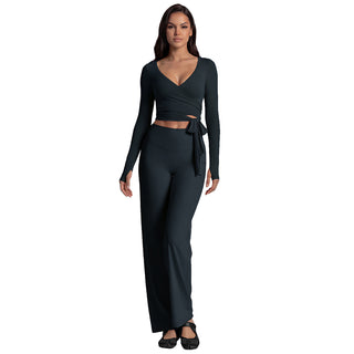 Ensemble yoga femme noir : haut manches longues à encolure V et pantalon évasé, noué