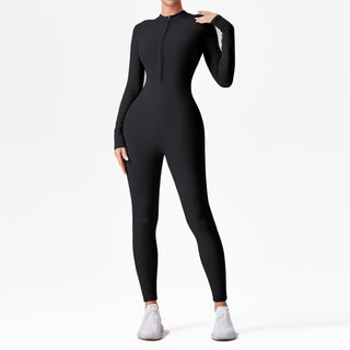 Combinaison de sport noire ajustée à manches longues et fermeture demi-zip