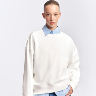 Sweat oversize femme à col rond, coton molletonné blanc cassé, manches longues tombantes