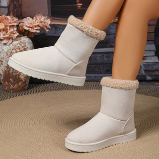 Bottes fourrées mi-mollet blanches, revers en moumoute, empiècement latéral, semelle épaisse