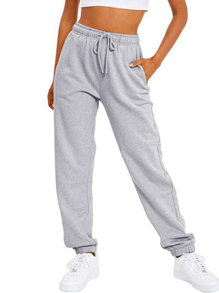 Pantalon de sport ample gris, taille élastique à cordon, bas resserré