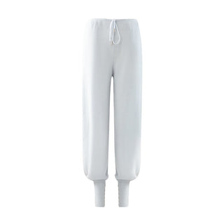 Pantalon de jogging en maille blanche, taille à cordon, bas resserré côtelé.
