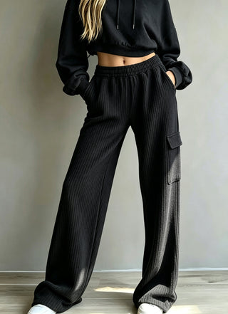 Pantalon large noir à taille haute élastique, cordon, poches cargo et texture rayée