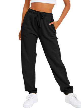 Pantalon de sport ample noir, taille élastique à cordon, bas resserré