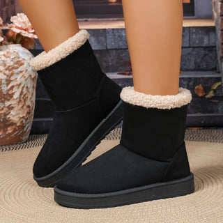 Bottes fourrées mi-mollet noires, revers en moumoute, semelle antidérapante robuste