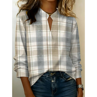 Blouse à manches longues à col V fendu, fluide, blanc et gris à carreaux.