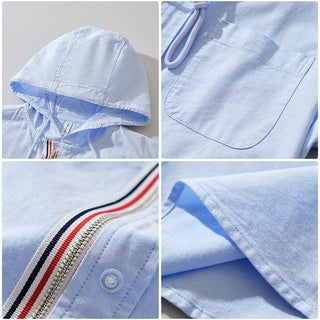 Veste à capuche en lin bleu clair, détails de couture et cordon de coulisse.
