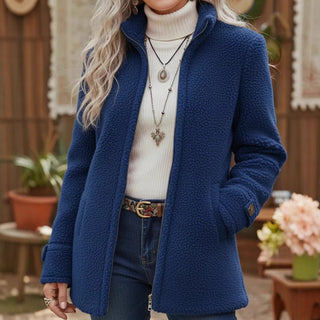 Veste mi-longue en sherpa bleu, à col montant, fermeture éclair et poches latérales