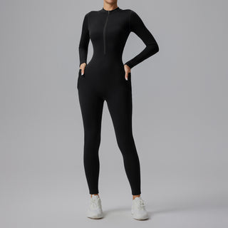 Combinaison de sport noire moulante à manches longues, demi-zip et poches latérales