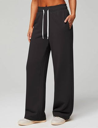 Pantalon de jogging femme taille haute noir à cordon, jambe droite ample.