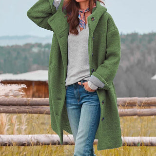 Manteau long en laine vert à boutons, manches longues et poches sur les côtés
