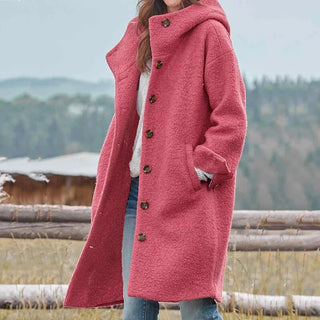 Manteau long en laine rose à boutons, col structuré et poches latérales
