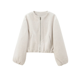 Veste bomber en polaire beige clair, zip au centre et poches à l’avant