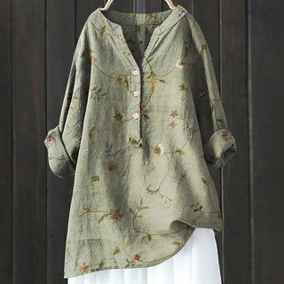 Blouse vert sauge clair à motif floral discret, col boutonné, manches longues.
