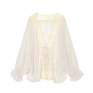 Blouse blanche fluide à dentelle ton sur ton et liens à nouer devant