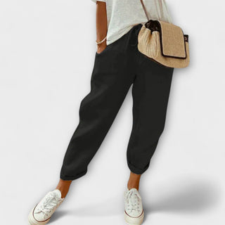 Pantalon décontracté noir à chevilles élastiques, coupe ample.