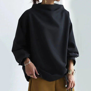 Pull oversize noir ample, col montant, manches tombantes