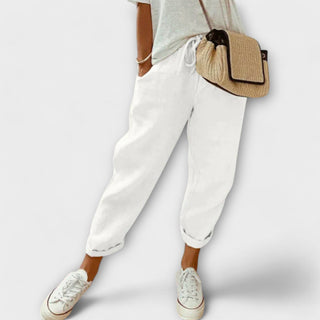 Pantalon décontracté blanc à chevilles élastiques, coupe ample.