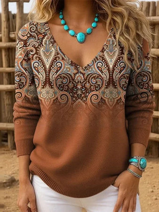 Pull en maille marron à encolure V, motif cachemire sur la partie supérieure.