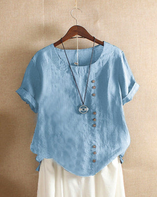 Blouse ample en lin bleu clair, col rond, boutons décoratifs à l’avant et manches courtes