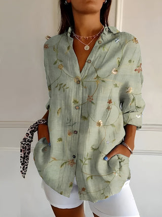Chemise fluide verte à motifs floraux, encolure boutonnée, manches longues