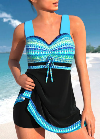 Robe-maillot à bretelles larges, haut à rayures bleues, jupe noire et nœud